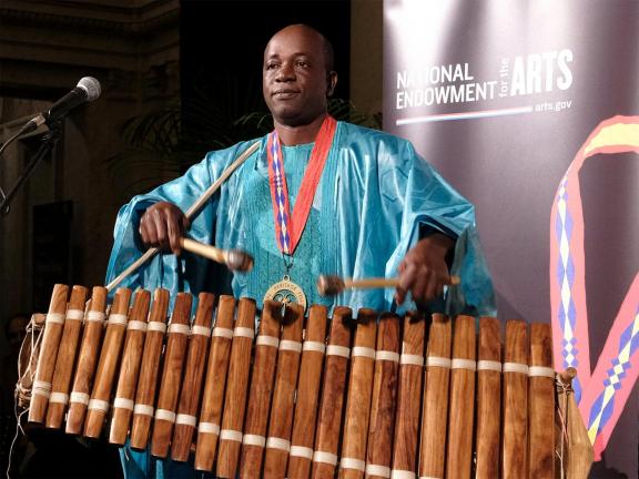 Man playing the balafon instrument