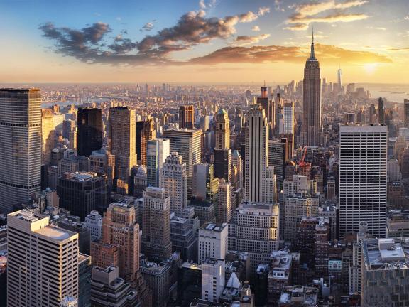 An aerial photo of New York City at sunset.