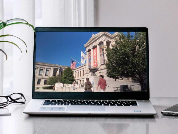 Laptop on a table with MFA facade on screen