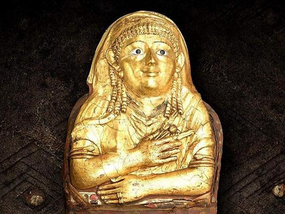 Gold mummy of a woman.