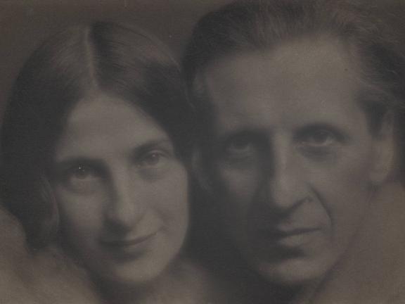 A photo of the faces of Stella Bloch and Ananda Coomaraswamy staring directly into the camera.