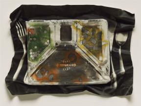 A crinkled canvas print of a tv dinner with a fork, spoon, and knife.