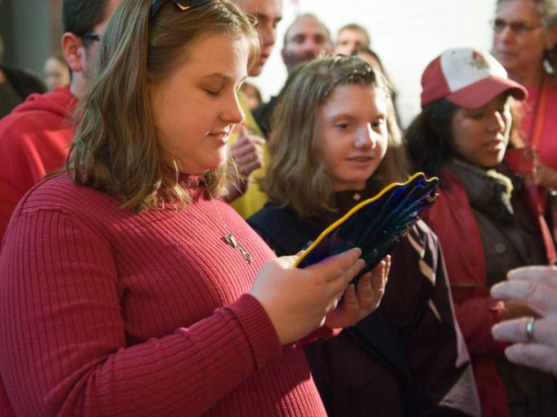 Perkins School students visiting Chihuly exhibition, girl holding plate