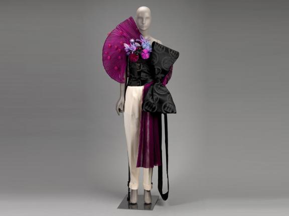 picture of a mannequin wearing a structural purple and black dress