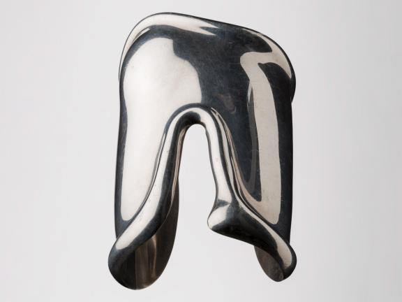 Photograph of a silver cuff style bracelet.