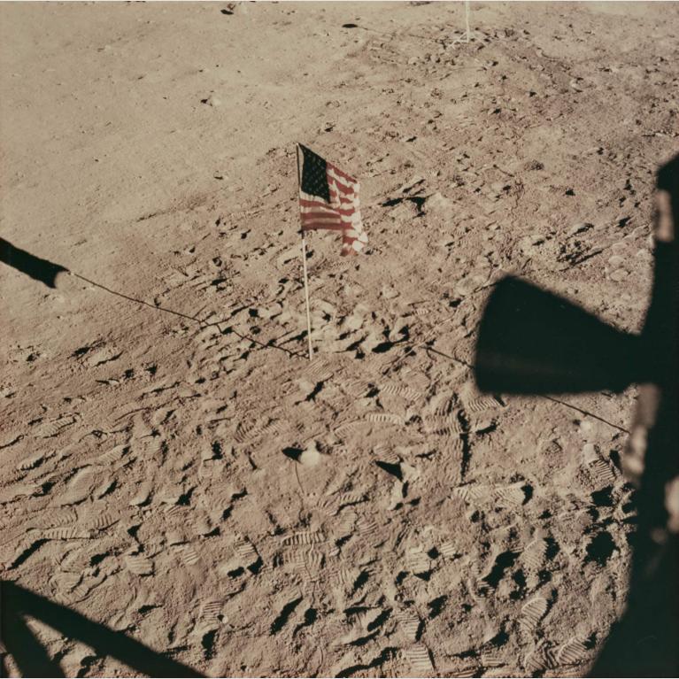A photo of the American flag planted on the surface of the moon.