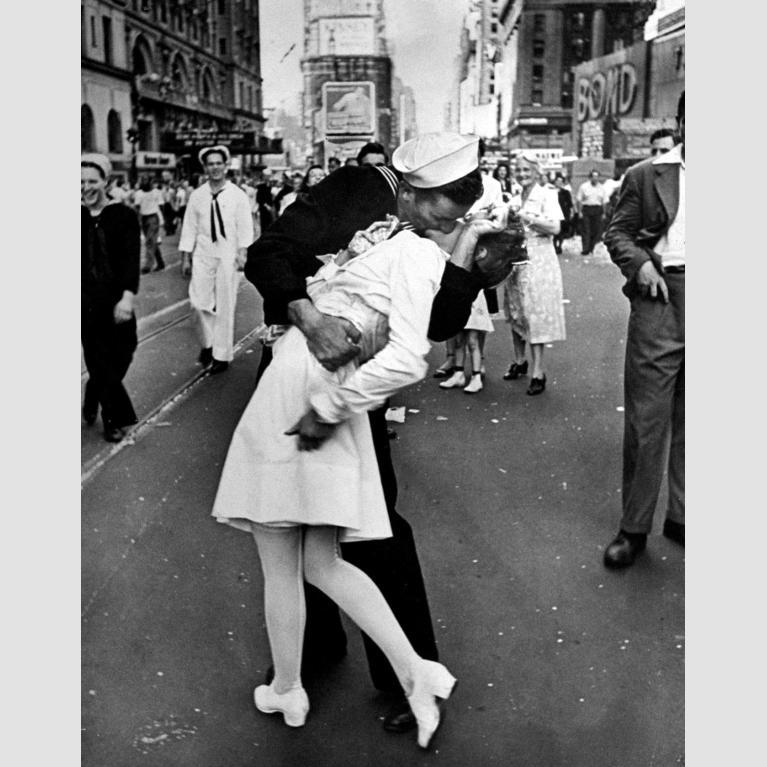 A U.S. Navy sailor kisses a dental assistant in Times Square, New York during V-J Day celebrations.
