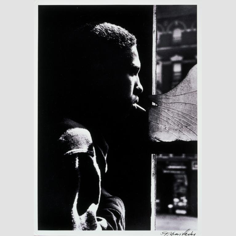 A man, Red Jackson, looks out of window.