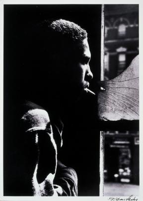 A man, Red Jackson, looks out of window. 