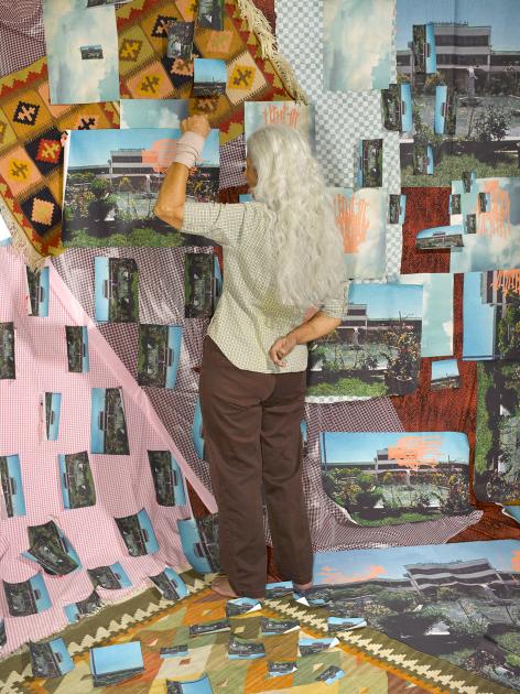 Artist Sheila Soleimani works on "Dissident," her piece that combines photo and fabric material.