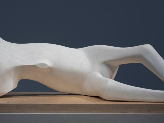 A marble bone-like statue resembling a reclining figure