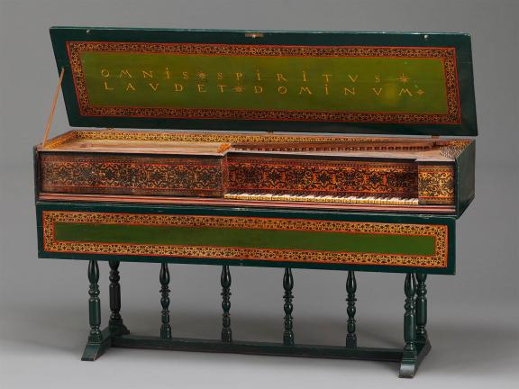 Color photograph of intricately decorated keyboard instrument.